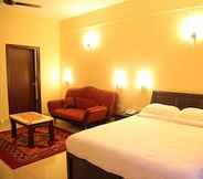 Kamar Tidur 7 Purple Hotels Resorts