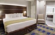 Bedroom 6 Days Inn & Suites by Wyndham Port Arthur