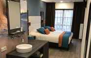 Kamar Tidur 4 Rivers Hotel & Restaurant