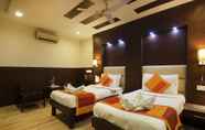 Kamar Tidur 2 Hotel Amaltas International by Orion Hotels