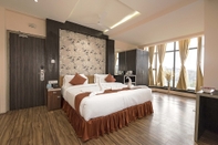 Bedroom Regenta Inn Larica