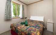 Kamar Tidur 4 Rainbow Pines Tourist Caravan Park