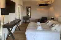 Phòng ngủ Swim Lodge Hotel Porto Vecchio