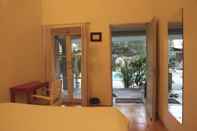 Bedroom Shantie Shakthi Vagator Resort with Swimming Pool