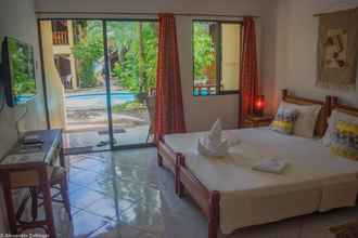 Kamar Tidur 4 Alona Vida Beach Resort