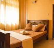 Kamar Tidur 6 Red Stone B&B