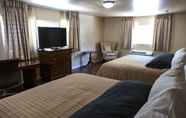 Bedroom 7 Abram Inn & Suites