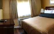 Kamar Tidur 3 Abram Inn & Suites