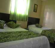 Kamar Tidur 3 Hotel Calarca N1