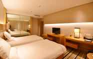 Bedroom 3 Qingdao Wushengguan Holiday Hotel
