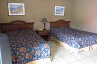 Kamar Tidur Travel Inn & Suites