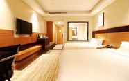 Bedroom 2 Qingdao Airport Fuhua Hotel