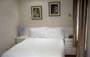 Kamar Tidur 4 Firs Hotel