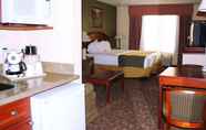 Bedroom 2 Magnuson Hotel Commerce