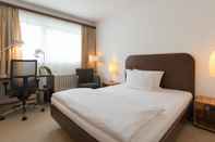 ห้องนอน ACHAT Hotel Corbin München Airport