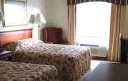 Bedroom 3 Econo Lodge Inn and Suites