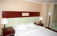 Bedroom 5 Canaan International Hotel