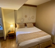 Kamar Tidur 4 Magna Praia Hotel