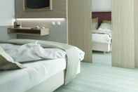 ห้องนอน Hotel Biancamano