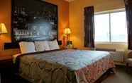 Bedroom 3 Super 8 by Wyndham Topeka at Forbes Landing