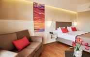 Bedroom 4 Ramada Plaza by Wyndham Thraki