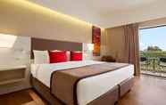 Bedroom 6 Ramada Plaza by Wyndham Thraki