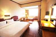 ห้องนอน Guangzhou Hotel