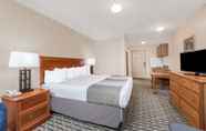 Bedroom 4 Days Inn & Suites by Wyndham Sellersburg
