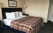 Bedroom 2 Red Carpet Inn & Suites