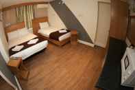 Kamar Tidur Kensington Suite Hotel