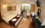 Kamar Tidur 6 Kensington Suite Hotel