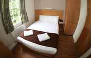 Kamar Tidur 4 Kensington Suite Hotel