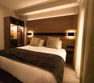 Kamar Tidur 6 Merit Kensington Hotel