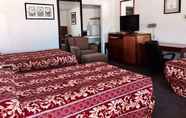 ห้องนอน 4 Maple Inn & Suites