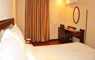 Bedroom 6 GreenTree Inn Taizhou Taixing East Guoqing Road RT Mart Business Hotel