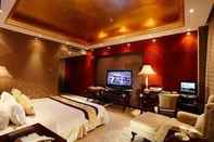 Bedroom HNA New World Hotel Danzhou