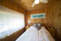 Kamar Tidur Mundic Waterfront Cottages