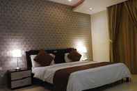 ห้องนอน Romooz Inn Hotel Suites
