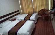 Kamar Tidur 3 Huayun Business Hotel