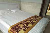 Kamar Tidur Qufu Shunxing Inn