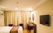 Bedroom 2 GreenTree Inn TaiZhou XingHua WuLi Road WuLi Bridge Express Hotel