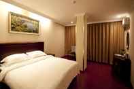 Bedroom GreenTree Inn TaiZhou XianJu Passenger Center West HuanCheng Road Express Hotel