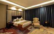 Kamar Tidur 4 Days Hotel & Suites Shishi