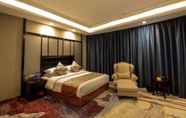 Kamar Tidur 4 Days Hotel & Suites Shishi