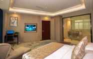 Kamar Tidur 7 Days Hotel & Suites Shishi