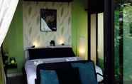 Kamar Tidur 7 The Proud Green Garden Hill Resort