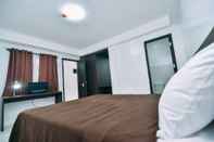 Bilik Tidur The Strand Suites and Dormitel