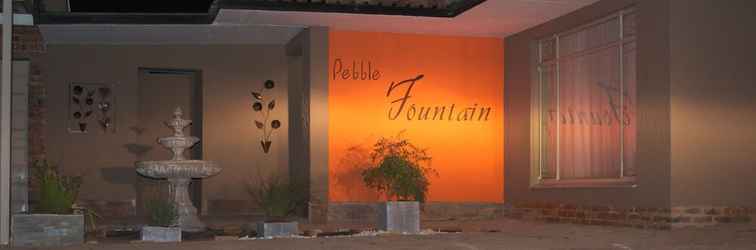 Exterior Pebble Fountain Guesthouse