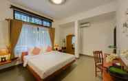 Kamar Tidur 6 Mango Bellana Boutique Hotel