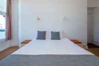 Kamar Tidur Whitehouse Hotel